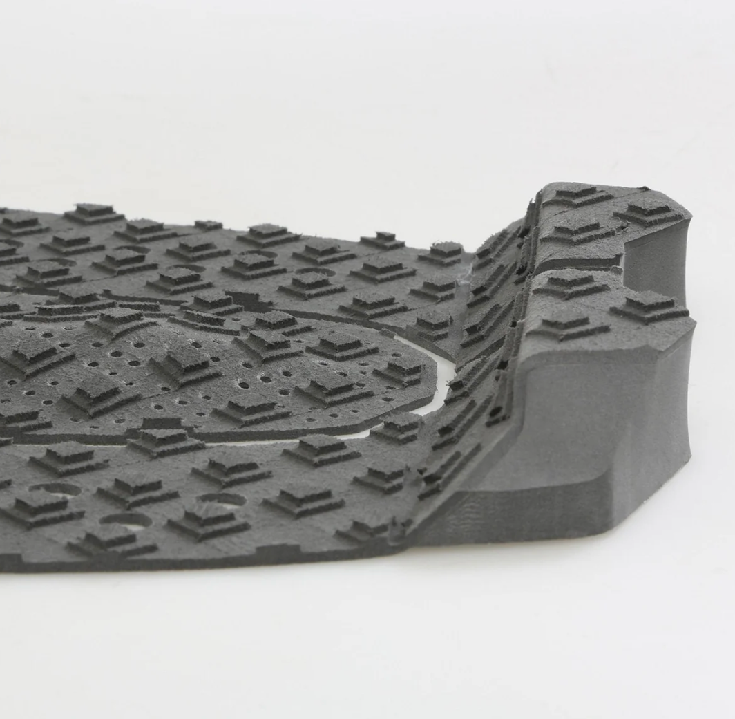 Gray rubber mat with textured surface on a white background