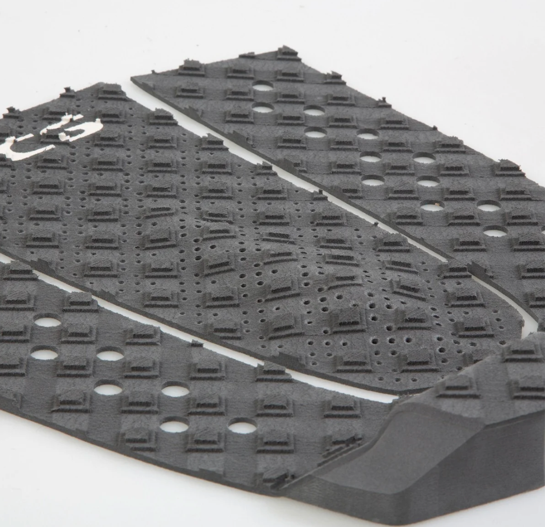 Black textured mat with a white brand logo on a white background