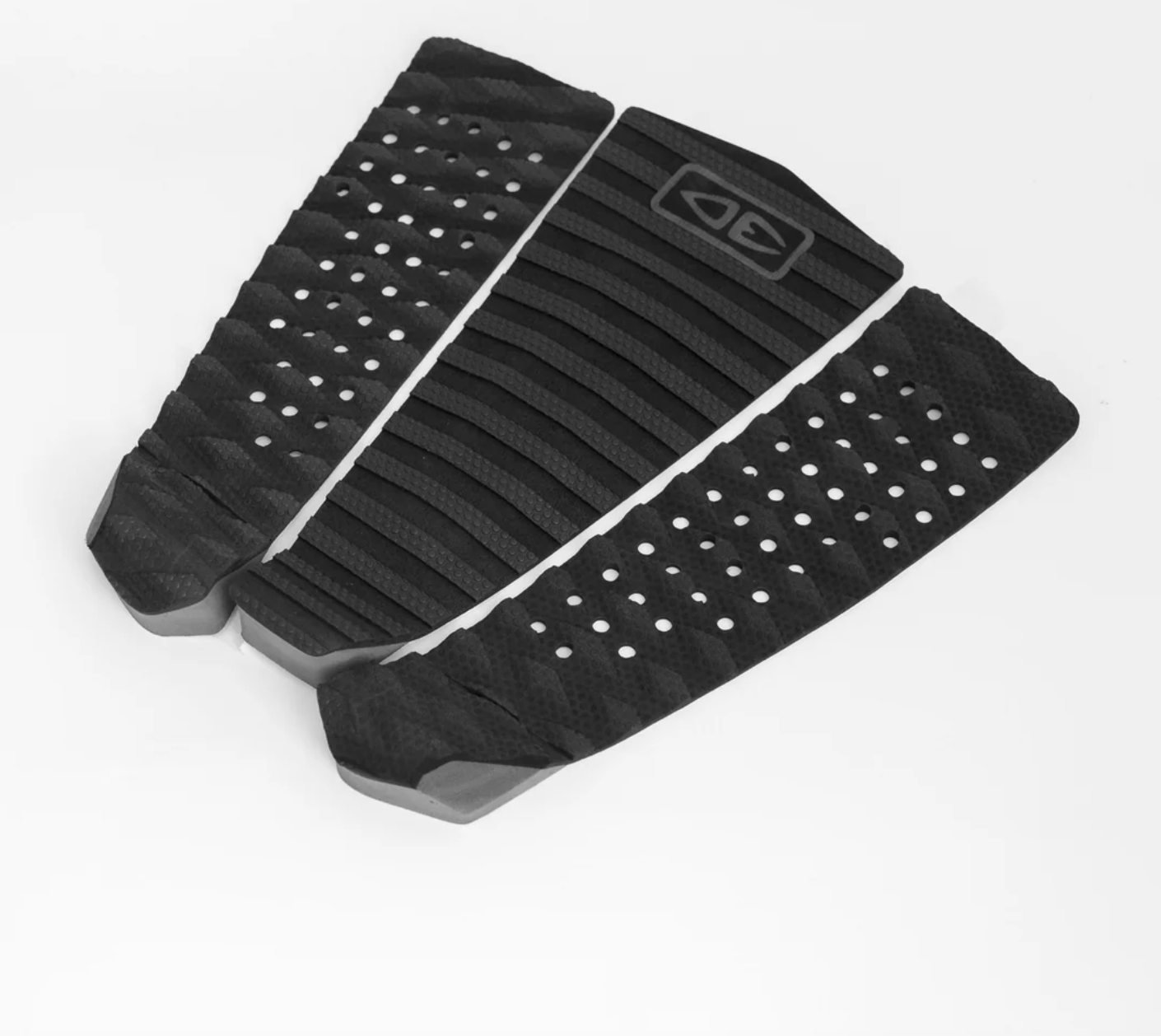 Black textured surfboard fins on a white background