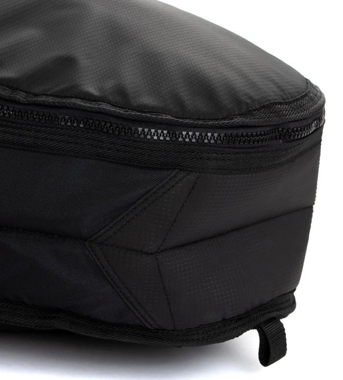 Close-up of a black bag with a zipper on a white background