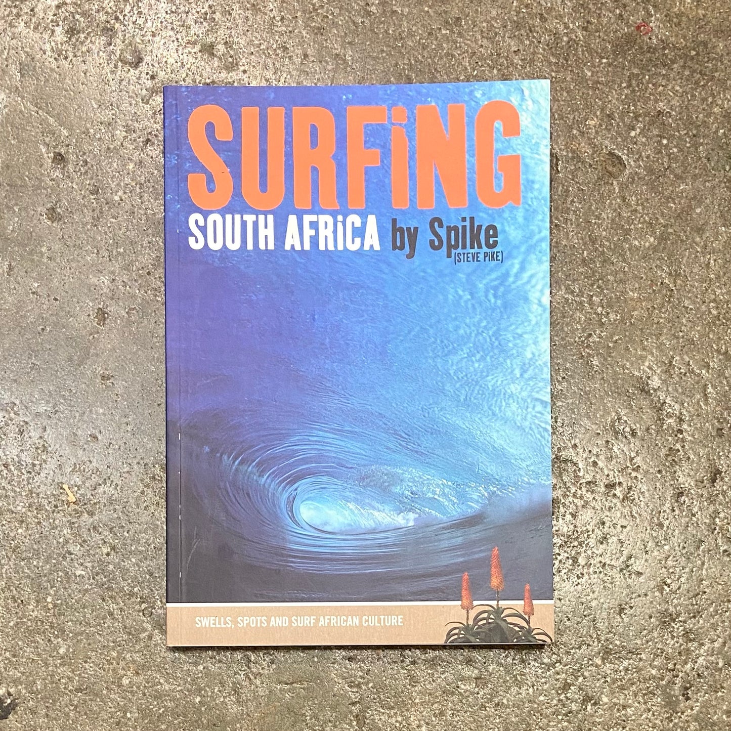 SURFING SOUTH AFRICA BOOK   ON CONCRETE SURFACE