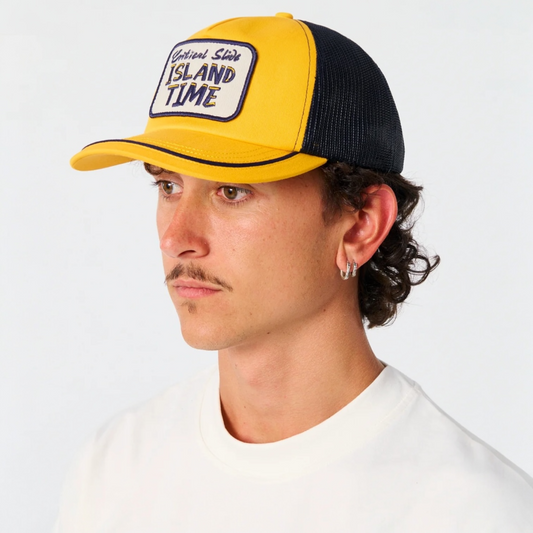 Man wearing a yellow and black cap with 'Island Time' text on a white background