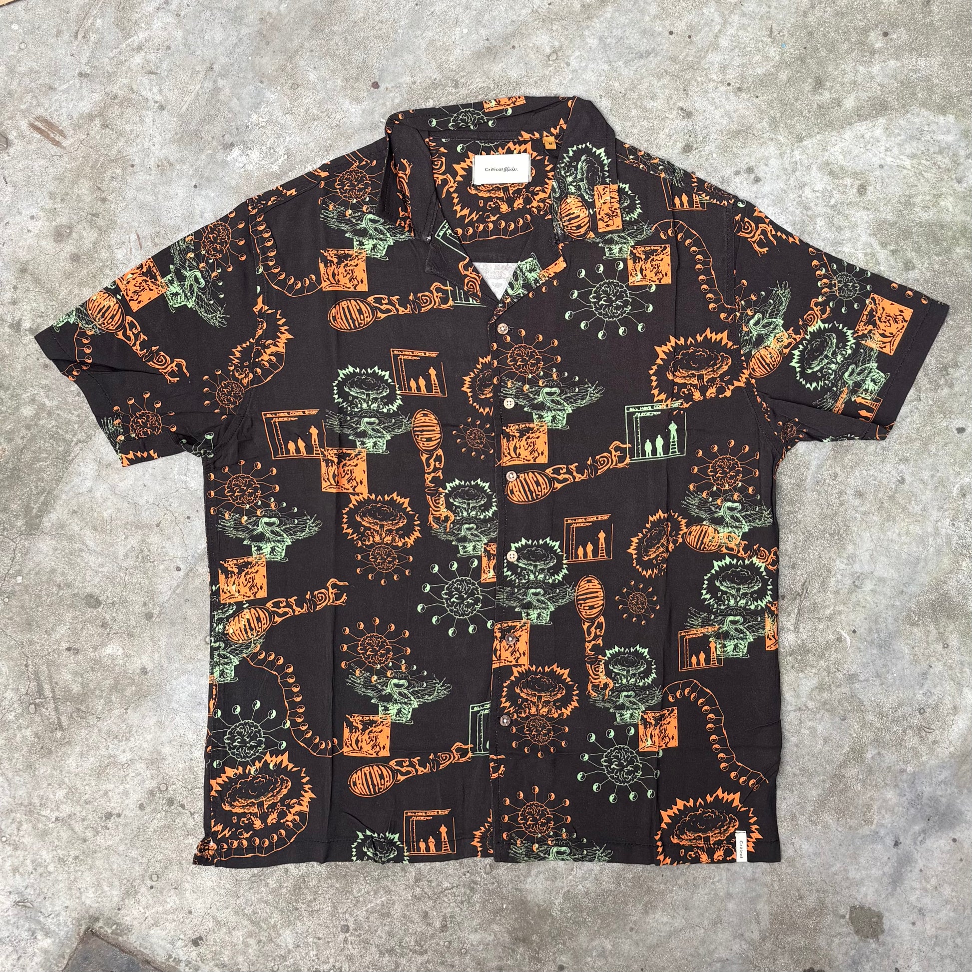 Short-sleeve shirt with a colorful pattern on a textured surface