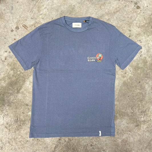 Blue t-shirt with a logo on a concrete surface
