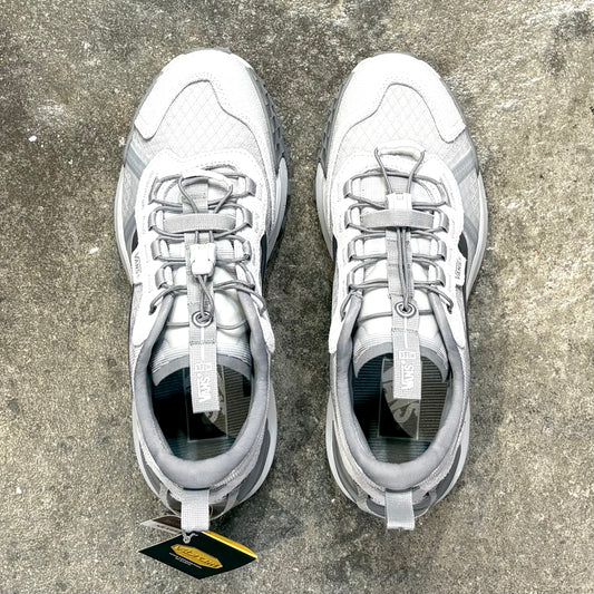 Grey Vans Shoes on a concrete surface