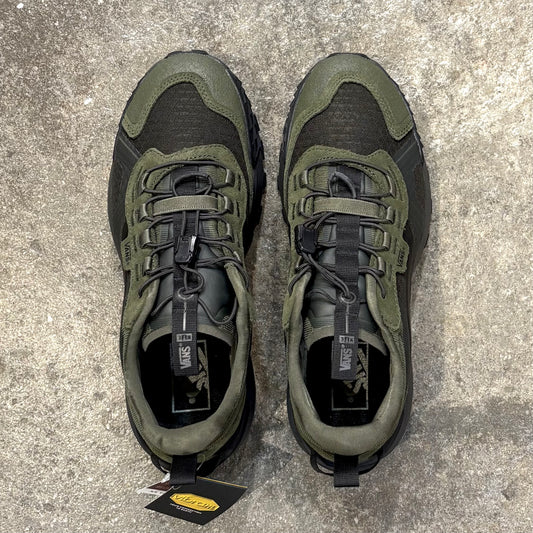 Pair of green and black VANS   MTE CROSSPATH XC sneakers on a concrete surface