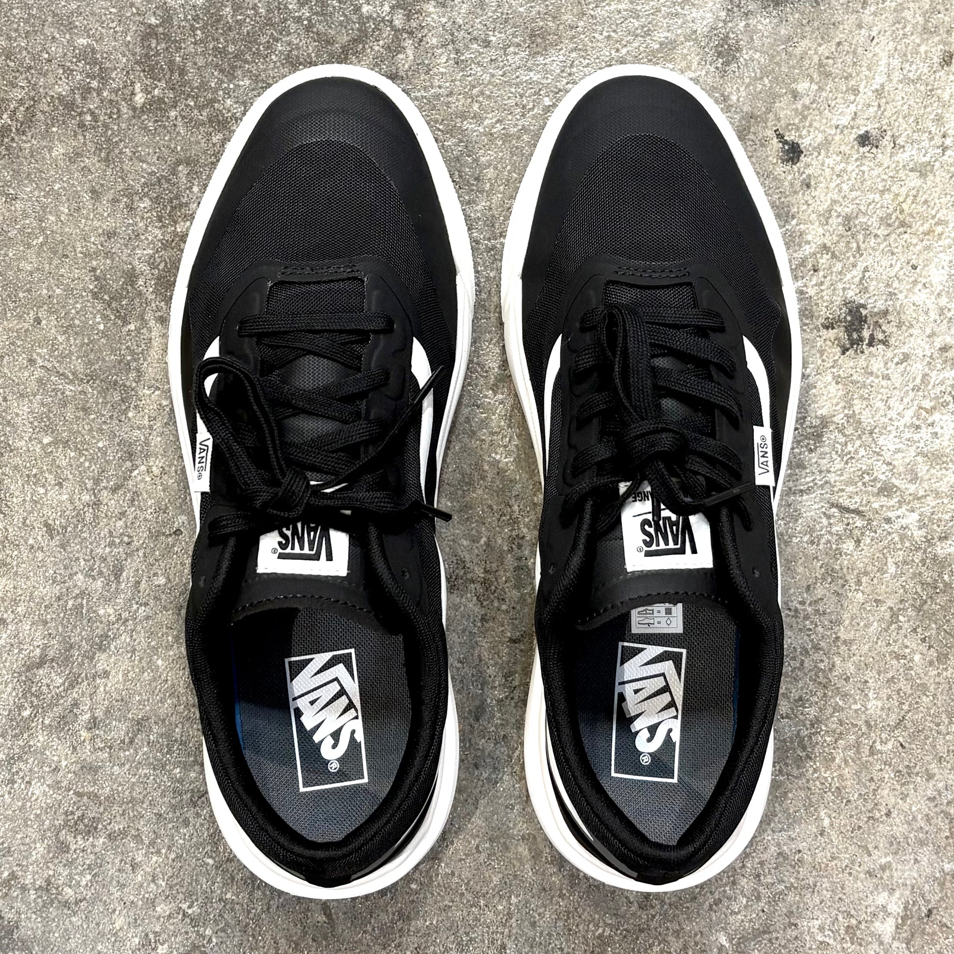 Pair of VANS   MTE ULTRARANGE 2.0 on concrete floor.