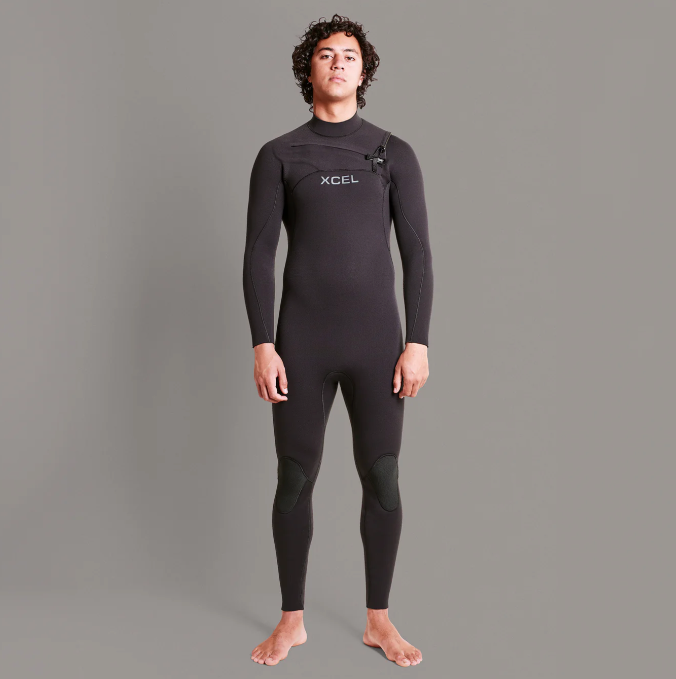 Front view stock shot of model wearing the Xcel Comp+ 4/3mm - Black - Men's Full Suit