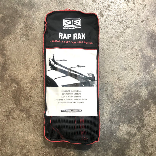 OCEAN&EARTH RAP RAX surfboard carrying rax, packaged in a black mesh bag with red trim, displaying the product and brand name on the label.